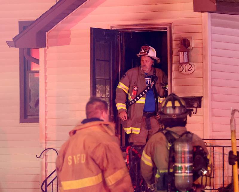 Spring Valley Fire chief Todd Bogatitus, exits a home in the 500 block of West Erie street for a structure fire on Monday, May 4, 2026 in Spring Valley. The fire happened shortly before 10:45p.m. A Mutual Aid Box Alarm System (MABAS) call was dispatched for additional fire departments from Eastern Bureau County, Peru, Utica, Oglesby and La Salle.
