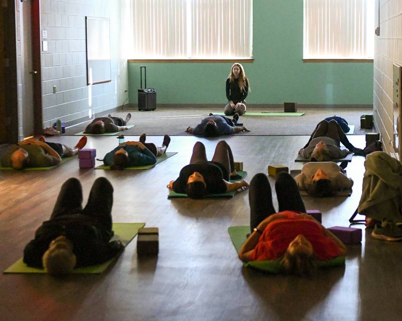 Kylie Grogan a yoga instructor and personal trainer at the Downers Grove Park district instructs a yoga class on Saturday Jan. 11, 2025, during the FitFest event held at the Downers Grove Park District recreation center.