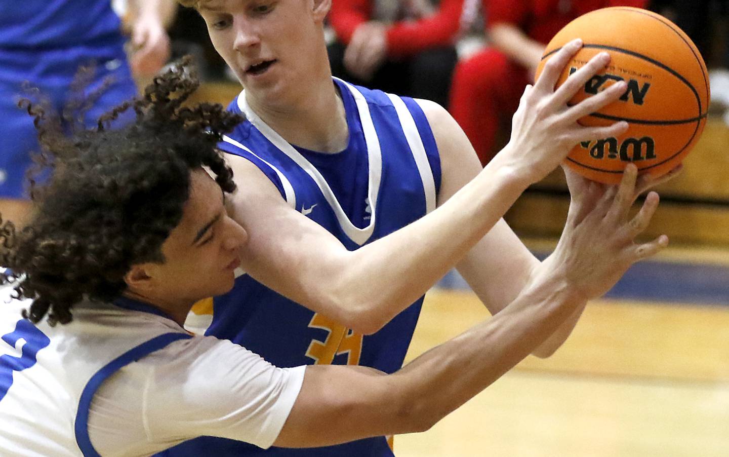 Woodstock's Jeremy Stokes tries to steal the ball from Johnsburg's Danny Loud during a Kishwaukee River Conference basketball game on Friday,  Feb. 14, 2025, at Woodstock High School.
