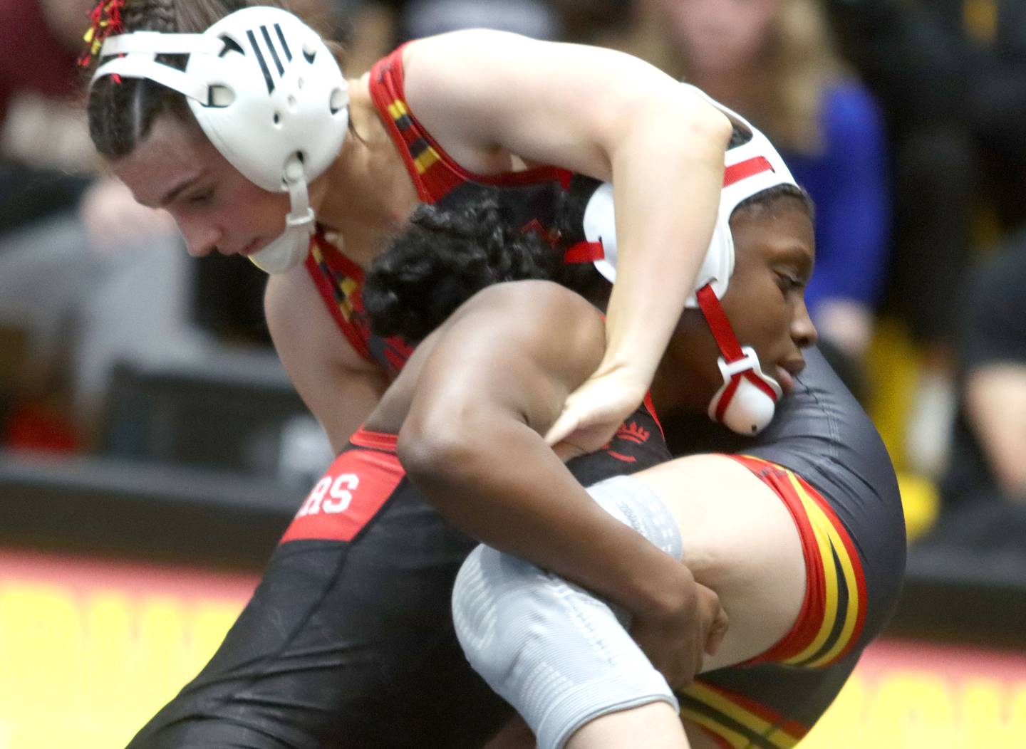 Huntley’s Janiah Slaughter, left, battles Batavia’s Lily Enos at 100 pounds in varsity girls IHSA Sectional wrestling on Saturday, February 14, 2026, at Schaumburg High School in Schaumburg.