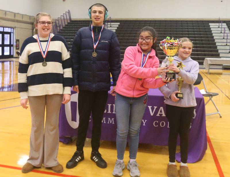 Putnam County students (from left) Mia Mennie, Isaac Rodriguez, Laila Rivera, and Aubree Smith pose for a photo during the Edible Car Contest on Wednesday, Feb. 25, 2026 at Illinois Valley Community College in Oglesby. The group won the award for fastest overall car.