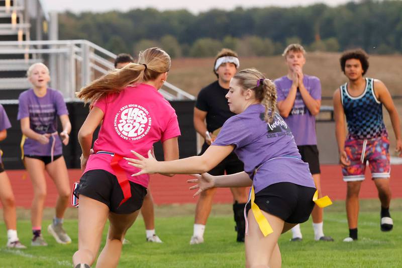 Erie High School sophomore Kelsi Packer tries to snatch the flag off opponent, senior Aubrey Huisman during the Wednesday, Oct. 1, 2025, Powder Puff football tournament in Erie. Girls competed grouped together by graduating class, the senior class of 2026 won the trophy.