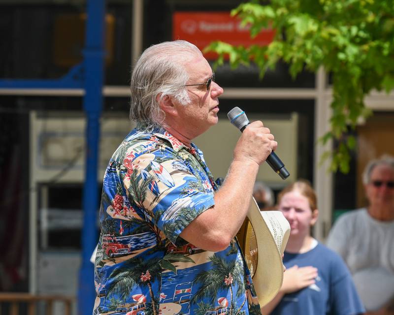 Mike Tritle sings the national anthem during the Turning back time car show on Sunday July 27, 2025, held in downtown Sycamore.