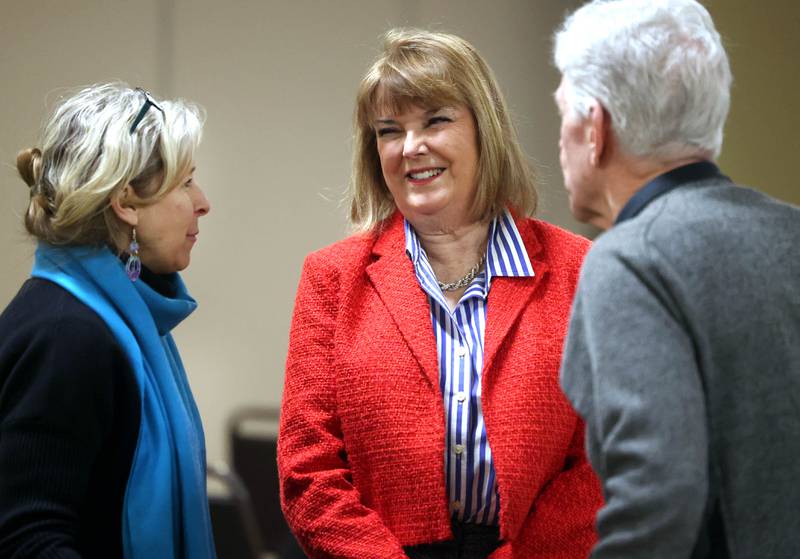 Barbara Larson, (center) DeKalb Second Ward Alderwoman who is running for re-election, talks to attendees Wednesday, Feb. 19, 2025, at the DeKalb Area Rental Association and DeKalb Area Builders Association Candidate Night at Faranda's Banquet Center in DeKalb.