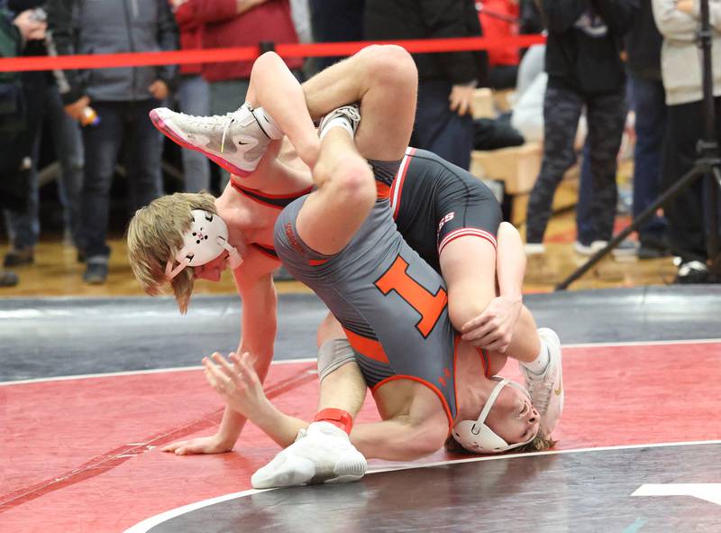 Yorkville's Jack Ferguson goes up against against Minooka's Cale Stonitsch during the Southwest Prairie Conference wrestling meet at Yorkville High School on Saturday, Jan. 21, 2023.