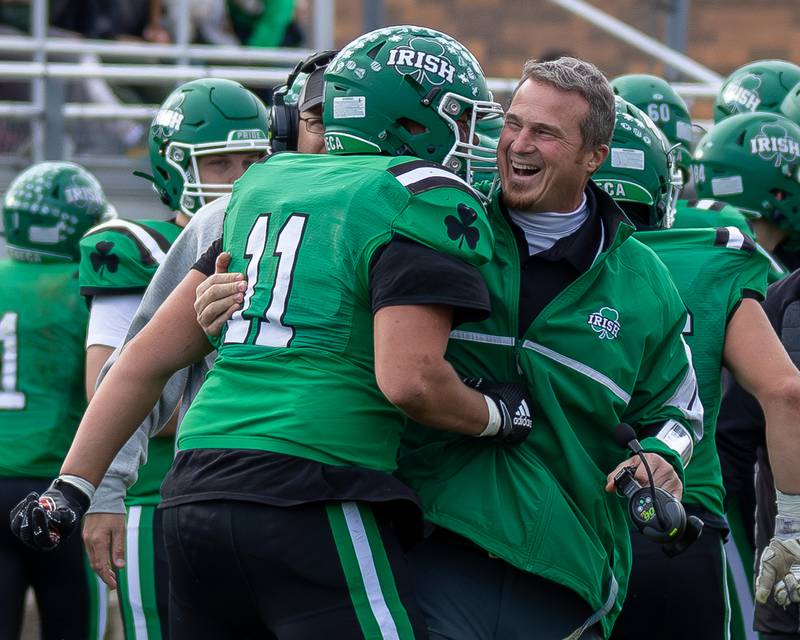 Zebadiah Maxwell (11) of Seneca embraces Head Coach, Terry Maxwell on Saturday, November 1, 2025 at Seneca High School in Seneca.