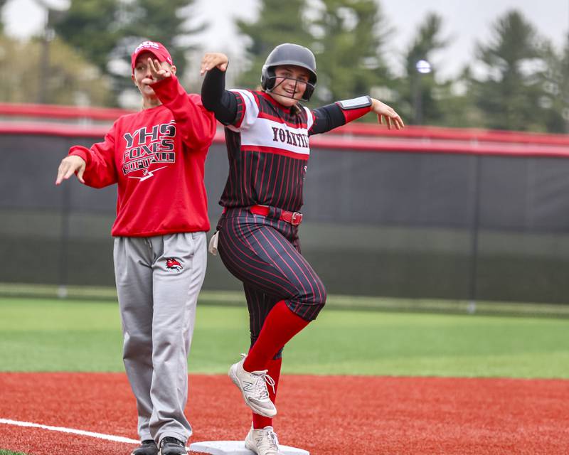 Yorkville's Kayla Kersting (10) celebrates on third during softball game between Joliet West at Yorkville on Wednesday, April 30, 2025 in Yorkville.