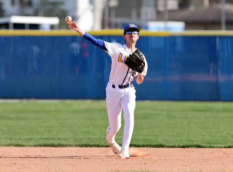 Lyons Township's Michael Mango (2) warms up between innings during the boys varsity baseball game between Lyons Township and Downers Grove North high schools in Western Springs on Tuesday, April 11, 2023.