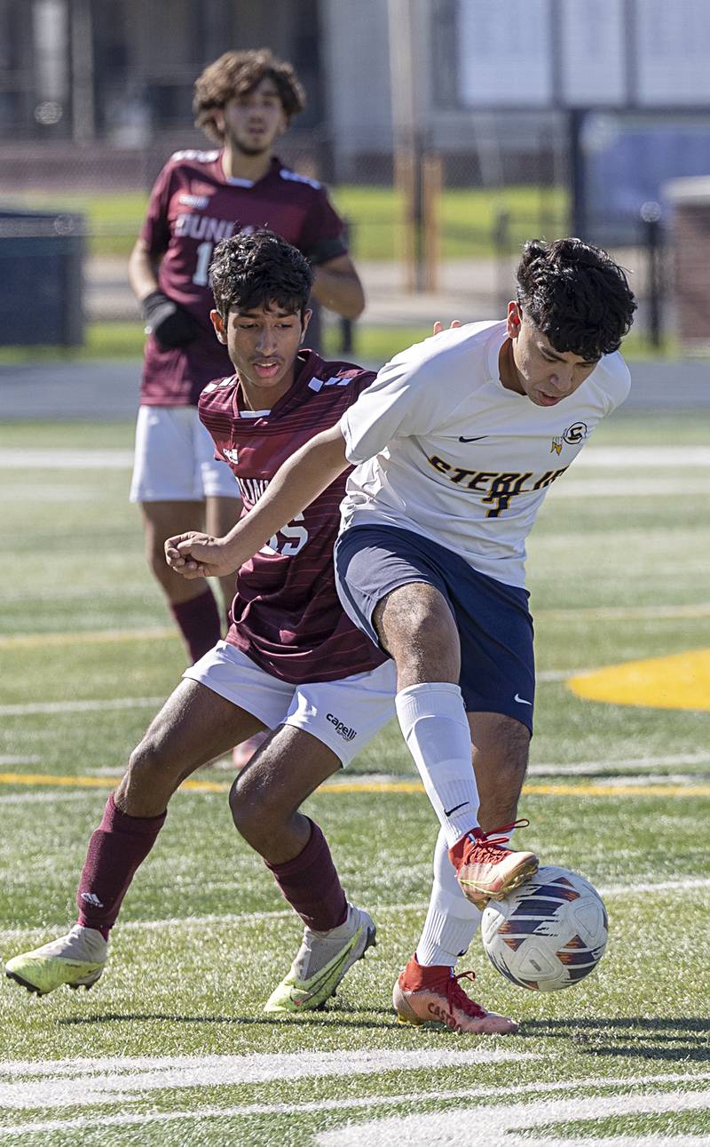 Sterling’s Jose Castro and Dunlap’s Yoshant Adhikari battle for the ball Saturday, Oct. 21, 2023 in the regional finals game in Sterling.