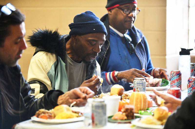 Ron Jackson, of Pembroke, prepares to take a bite of hot food Wednesday during the Kankakee Salvation Army’s annual Thanksgiving meal.