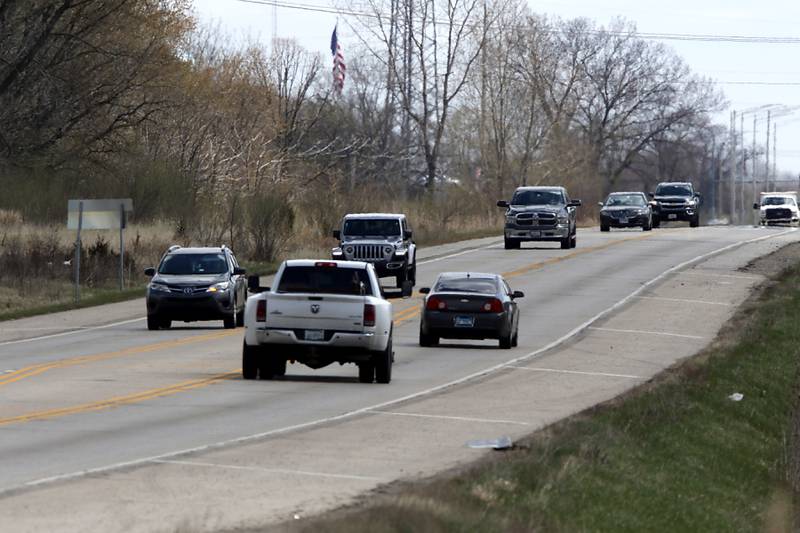 Vehicles travel U.S. Route 14 on Tuesday, April 26, 2022, near Dean Street in Woodstock. The Illinois Department of Transportation is resurfacing a nearly six-mile stretch of U.S. Route 14, running west from Hughes and Hartland roads to IL Route 47. The road is a popular route from Woodstock to Harvard and into Wisconsin.