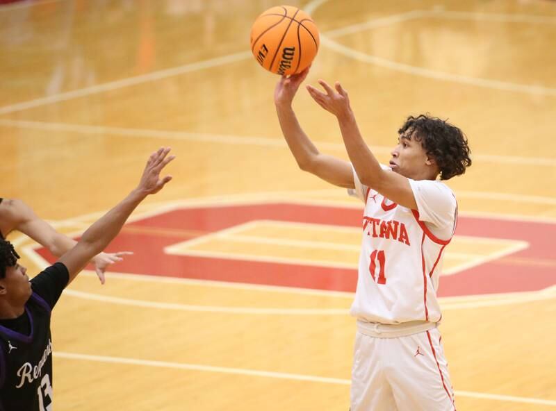 Ottawa's Hezekiah Joachim shoots a jump shot over Plano's Amari Bryant during the Dean Riley Shootin' The Rock Thanksgiving Tournament on Tuesday, Nov. 26, 2024 in Kingman Gym at Ottawa High School.