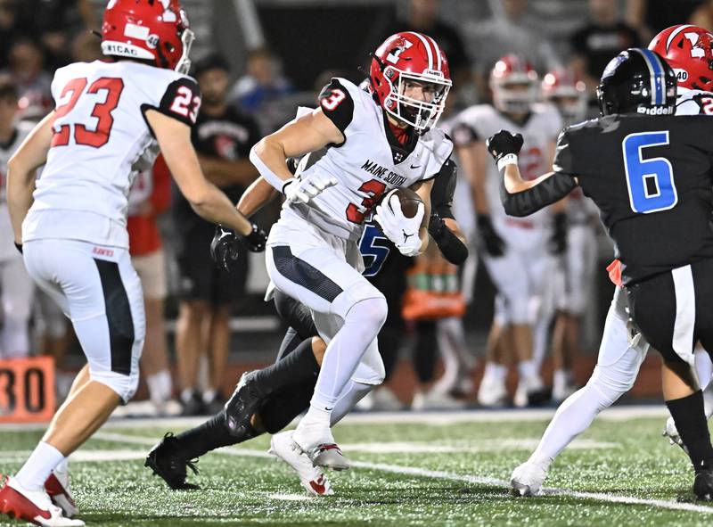 Maine South's Joey Naughton tries to pickup yards after a catch during a non-conference game against Lincoln-Way East on Friday, Aug. 30, 2024, at Frankfort. (Dean Reid for Shaw Local News Network)