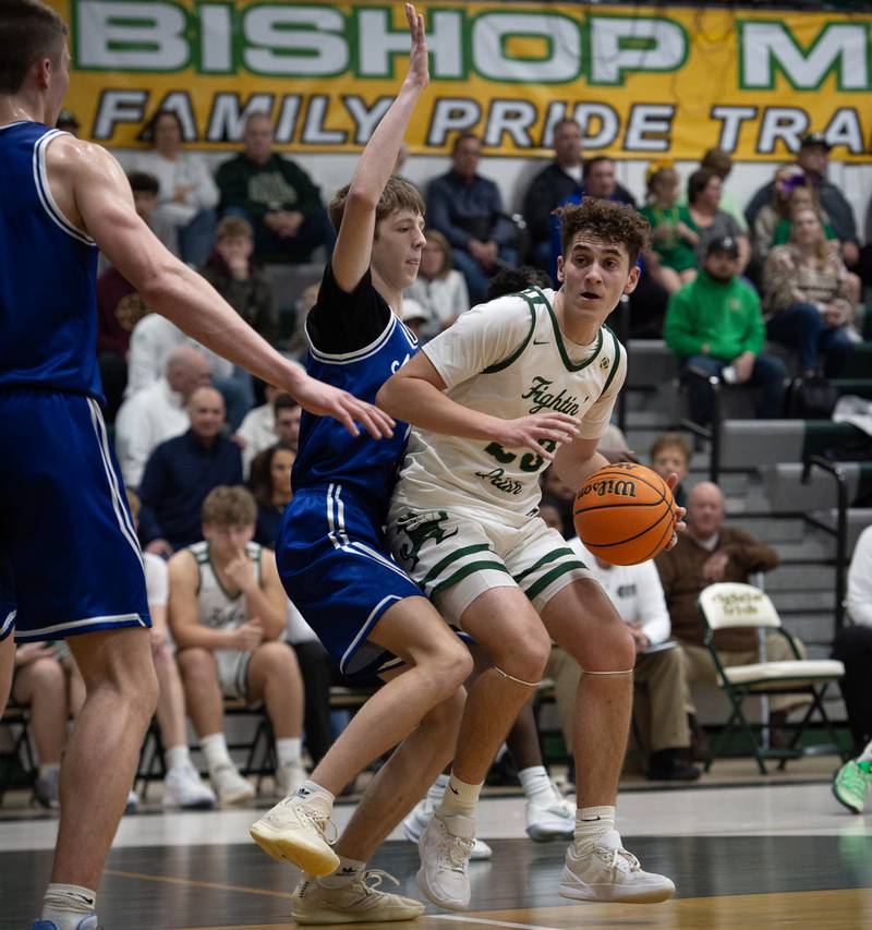 Bishop McNamara's Karter Krutsinger controls the ball as Newark's Dylan Kulbartz guards in a game on Friday, Feb. 20, 2026.