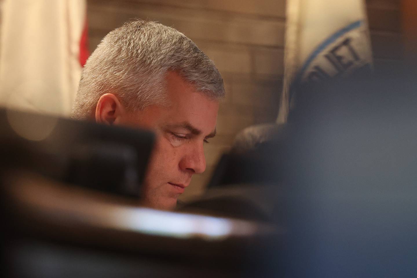 Mayor Bob O’Dekirk sits in on a hearing on the validity of nominating petitions of two City Council candidates at the Joliet City Electoral Board meeting on January 4th.