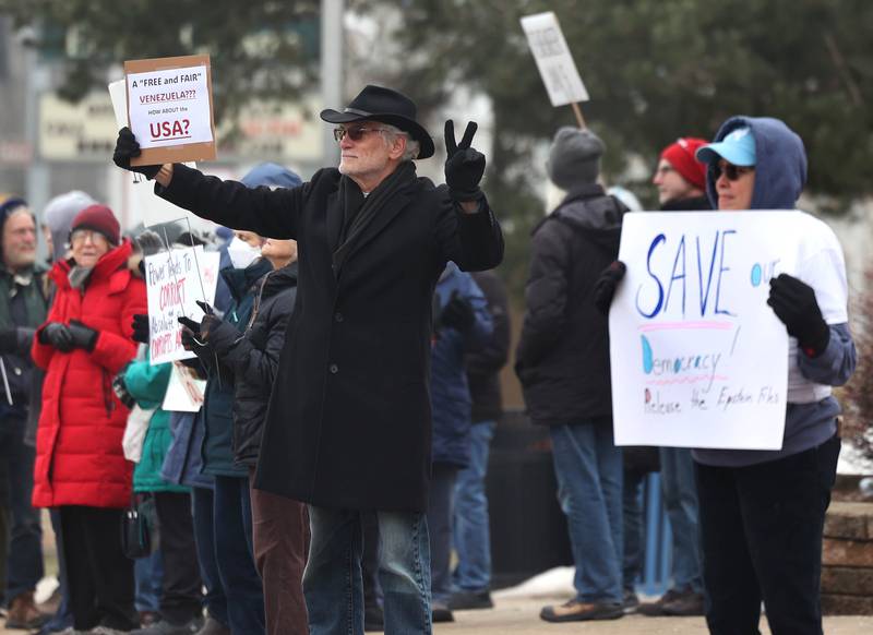 Protesters gathered Tuesday, Jan. 6, 2026, for a Venezuela Rapid Response Rally at Memorial Park on the corner of First Street and Lincoln Highway in DeKalb, to voice their opposition to President Donald Trump and the administrations recent actions in Venezuela.