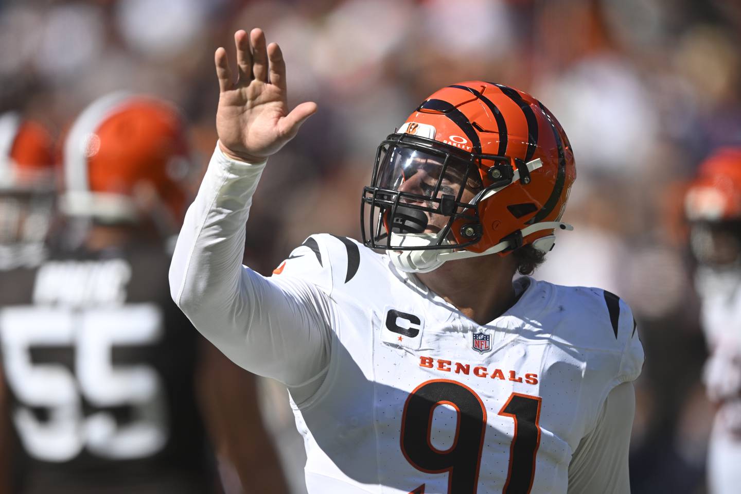 Cincinnati Bengals defensive end Trey Hendrickson (91) waves to fans during an NFL football game against the Cleveland Browns, Sunday, Sept. 7, 2025, in Cleveland. (AP Photo/David Richard)