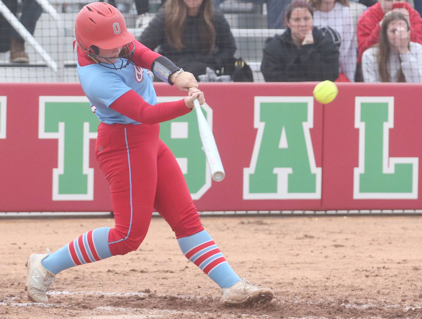 Ottawa's Bobbi Snook blasts a two-run home run against L-P in a game earlier this season at the L-P Athletic Complex in La Salle.