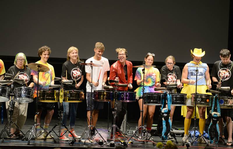 Downers Grove South High School students join members of Sheltered Reality as part of the assembly during Freshman orientation and Mad Dash held Saturday Aug 19, 2023.
