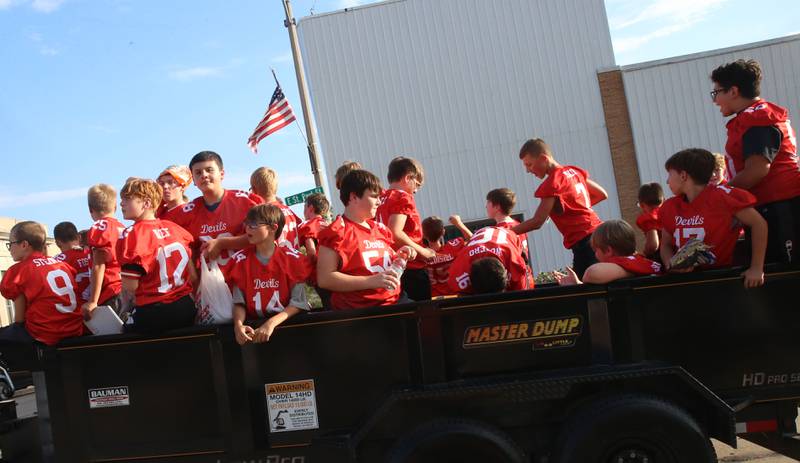 The Hall youth football team rides during the Homecoming parade on Thursday, Sept. 18, 2025 downtown Spring Valley.