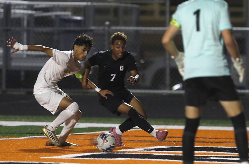 Prairie Ridge's Anthony Castro tries to knock McHenry's Miguel Rondon of the ball during a Fox Valley Conference boys soccer match on Tuesday, Sept. 30, 2025, at McCracken Field in McHenry.