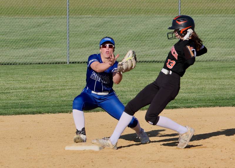 Sandwich's Kyra Johnson takes second. base Princeton's Kelsea Klingenberg awaits the throw in Thursday''s regional semifinals at Prather Field. The Tigresses won 9-6.