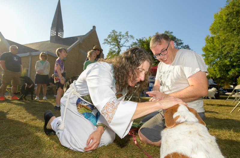 Geneva Lutheran Church’s Pastor Trudy Stoffel blesses “Joy” as her pet dad Adam Gibbons looks on during the church’s annual pet blessing service on Saturday, Oct 4, 2025 in Geneva.