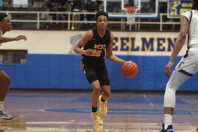 Joliet West’s Zion Gross works the ball upcourt against Joliet Central on Saturday, Jan. 27th, 2024 in Joliet.