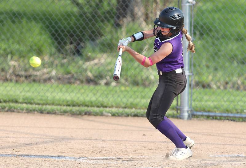 Dixon's Bailey Tegeler slaps the ball to the right side during their game against Sycamore Thursday, May 12, 2022, at Sycamore High School.