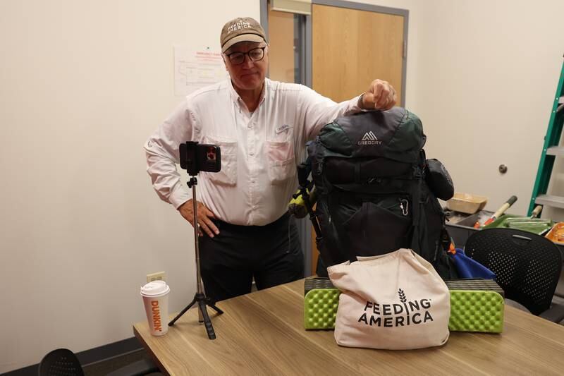 Feeding America supporter Brian Christner makes a stop from his walk across America to visit the South Suburban Center Food Bank on Tuesday, June 13, 2023 in Joliet. Brian started his fundraising journey in Delaware on February 19th and expects to finish outside San Francisco in December.