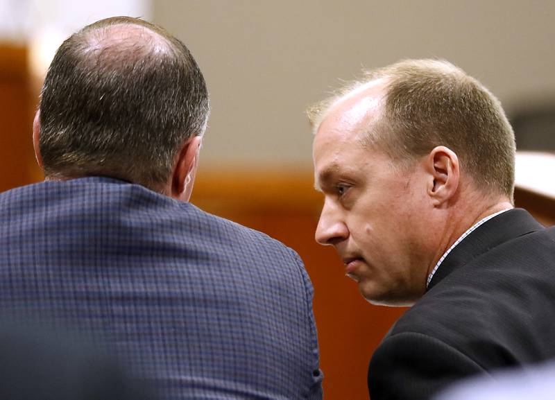 Defense attorney Robert Deters, right, talks with William Bishop, left, during Bishop’s bench trial before McHenry County Judge Michael Coppedge on Monday, Oct. 17, 2022, in the McHenry County courthouse in Woodstock.