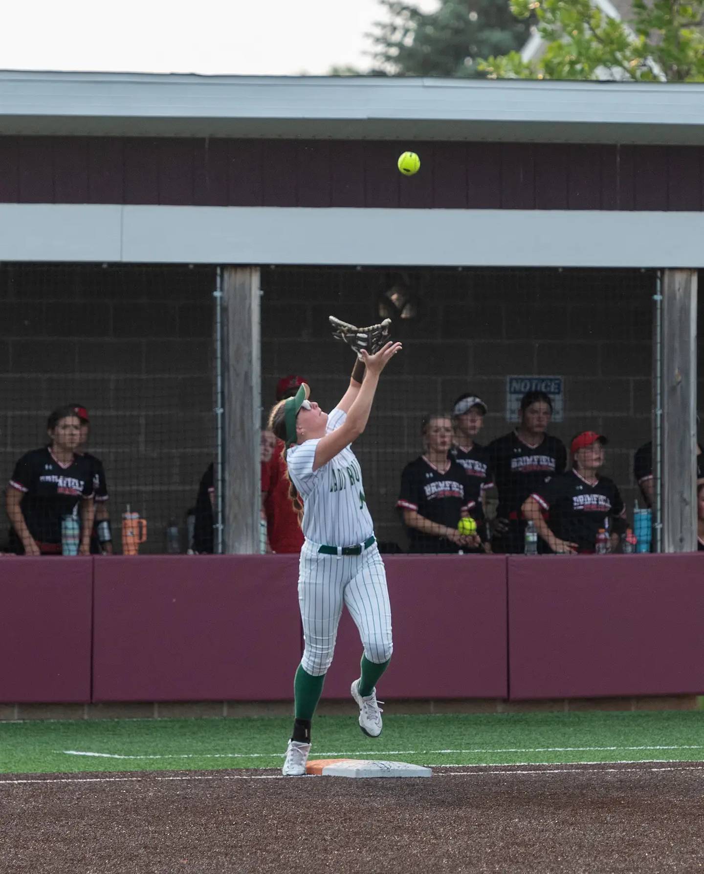 St. Bede first baseman Jillian Pinter tracks down a pop fly in Friday's sectional softball championship game in Chillicothe.
