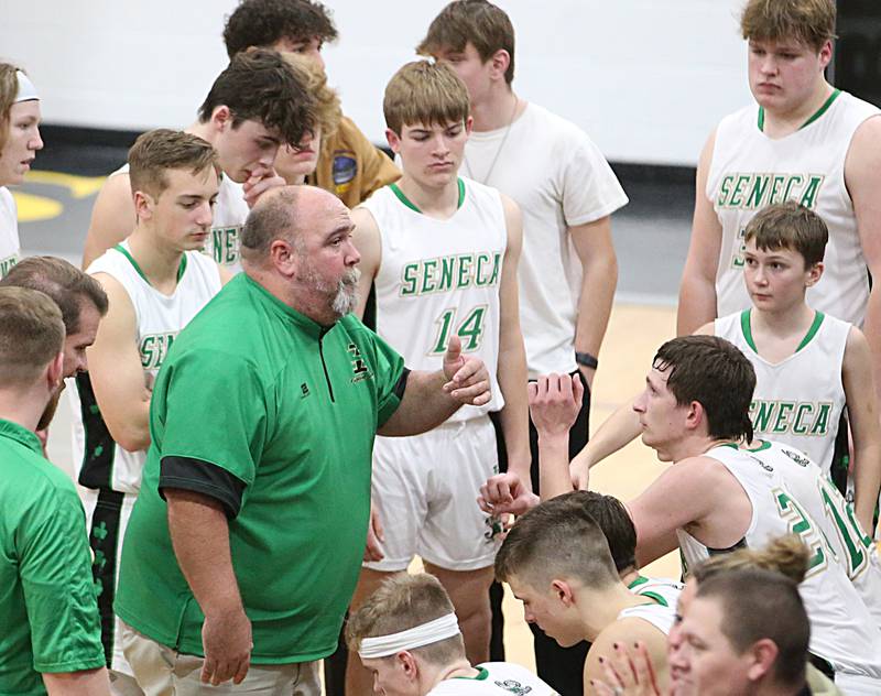 Seneca head boys basketball coach Russell Witte talks to his team during a timeout in the Tri-County Conference championship on Friday, Jan. 27, 2023 at Putnam County High School.