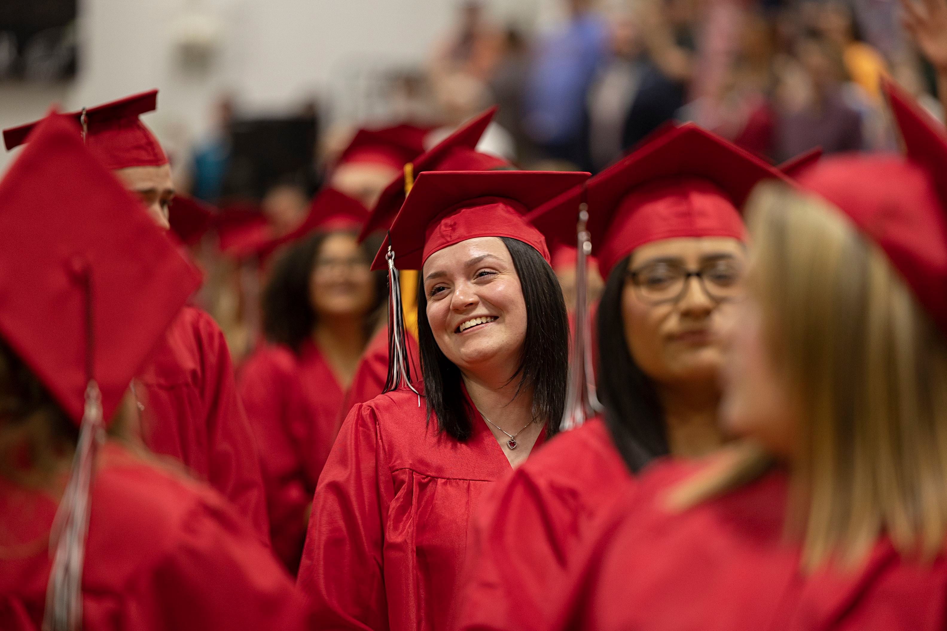 Graduates smile at loved ones after walking into the SVCC gym Friday, May 10, 2024 for the 2024 commencement ceremony.