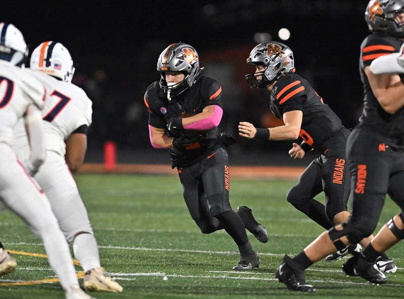 Minooka's Chase Nurczyk (2) runs the ball during the conference game against Oswego on Friday, OCT. 10, 2025, at Minooka.