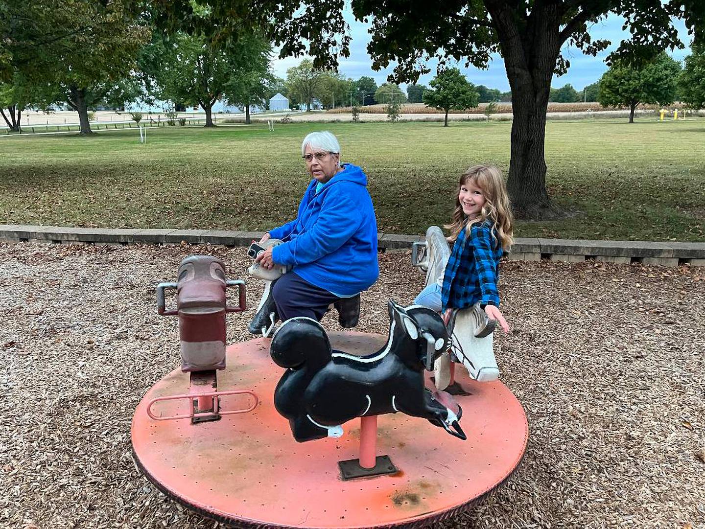 Lori Anderson, 67, of Kankakee, rides a merry-go-round with her great-grandaughter Erin. Anderson, who is seeking a life-saving kidney donation, said her hope is to be able to spend more time with her family and grandchildren.