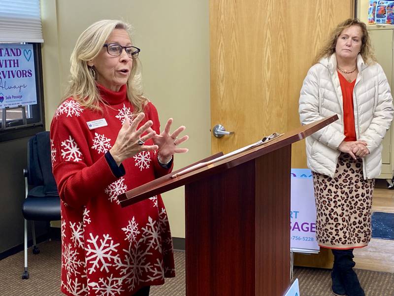 Christine Kalina (left), development director of Safe Passage Inc., speaks as Jennifer Yochem, community services coordinator of the city of DeKalb watches, on Friday, Dec. 5, 2025, at a groundbreaking ceremony for the agency's new crisis shelter, expected to begin construction in the spring.