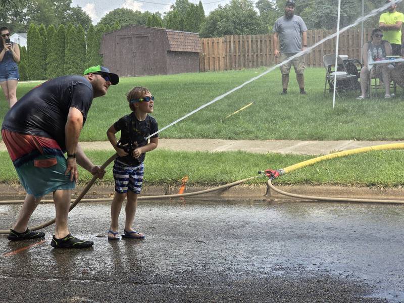 Emmett Gibson of Granville focuses on winning the water fight competition Saturday, Aug. 3, 2024, during Granville Days at Hopkins Park.
