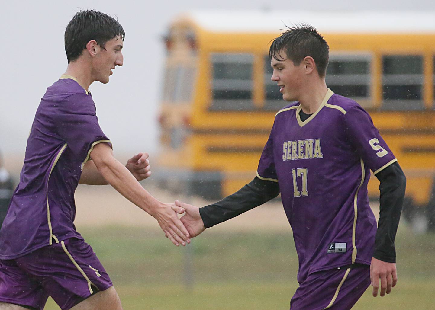 Serena's Richie Armour hi-fives teammate Beau Raikes (17) after scoring a goal against Sandwich in the Class 1A Regional semifinal game on Tuesday, Oct. 11, 2022 in Serena.
