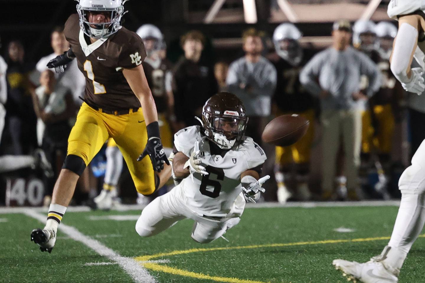 Joliet Catholic’s Preston Coleman dives for a pass against Mount Carmel on Friday, Oct. 11, 2024 in Chicago.