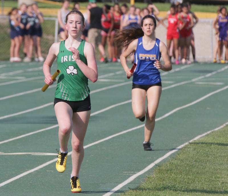 Seneca's Clara Bruno wins the 4x800 relay as Somonauk's Naroa Iturrioz runs behind in the Class 1A sectional girls track meet on Thursday, May 12, 2022 in Seneca.