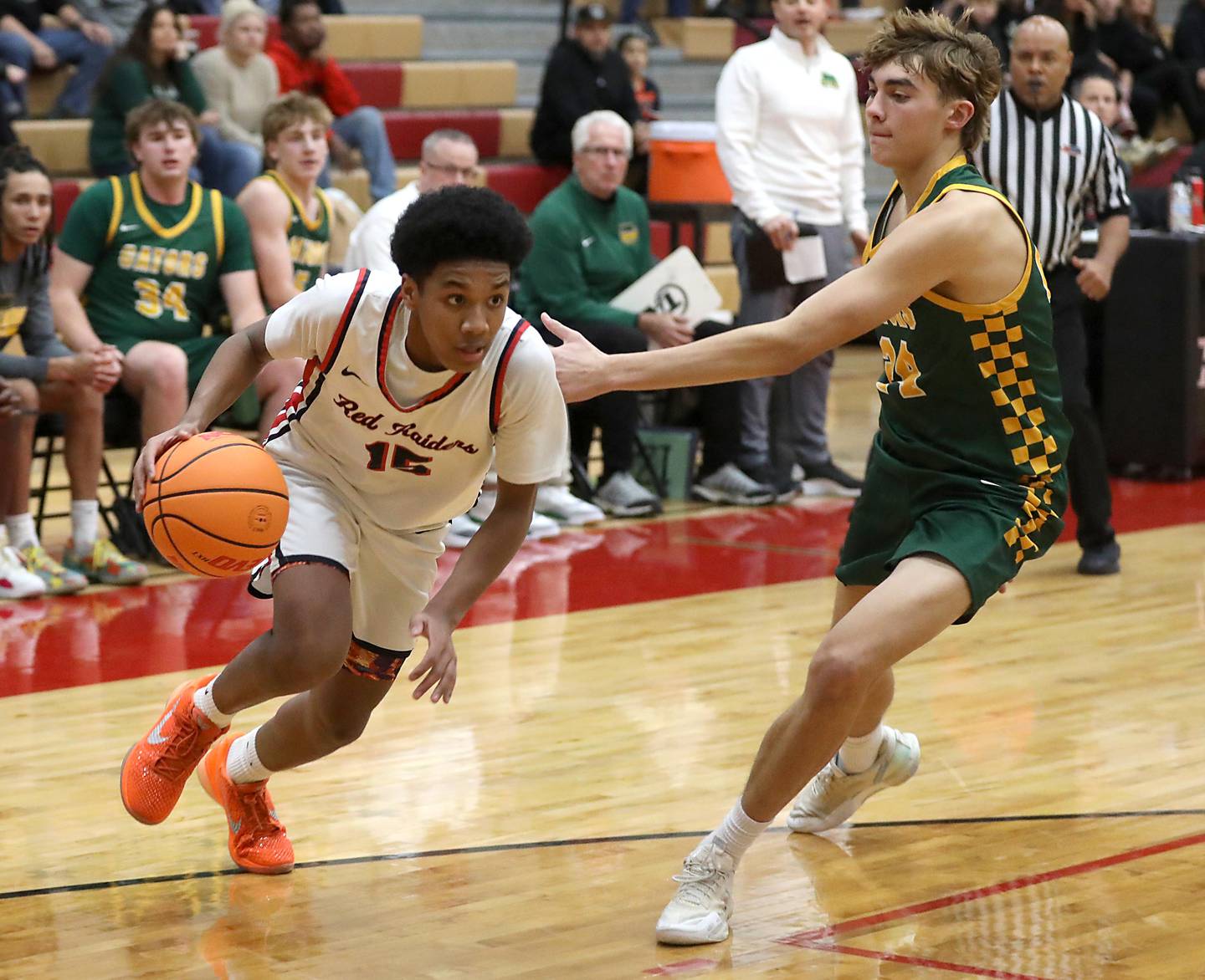 Huntley's Isaac Muze drives the baseline agains tCrystal Lake South's Vincent Santarelli during a Fox Valley Conference boys basketball game on Wednesday, Dec. 10, 2025, at Huntley High School.