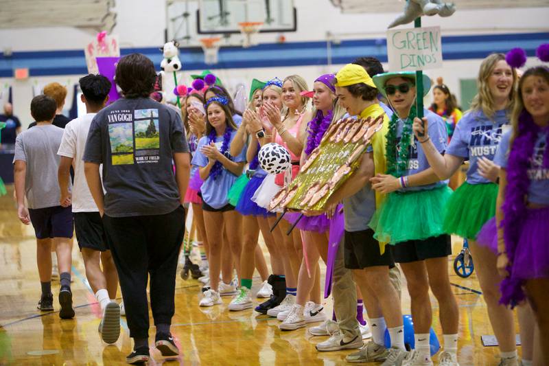 Downers Grove South freshmen enter the gym at the Mustang Mad Dash orientation on Saturday Aug.10, 2024 in Downers Grove.