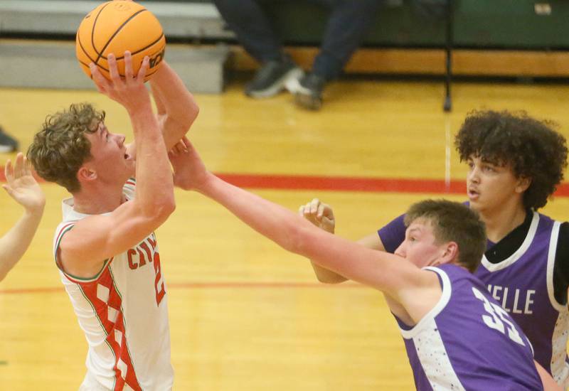 L-P's Regan Doerr lets go of a jump shot over Rochelle's Eli Schweitzer on Friday, Feb. 13, 2026 in Sellett Gymnasium at L-P High School.