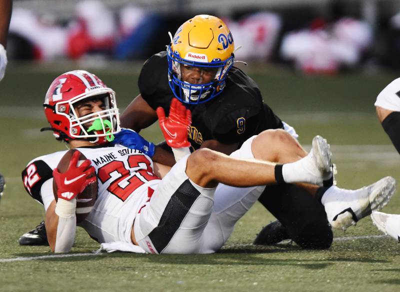 Joe Lewnard/jlewnard@dailyherald.com
Maine South’s Michael Dellumo, left, is stopped by Warren’s Aaron Stewart during Thursday’s game in Gurnee.
