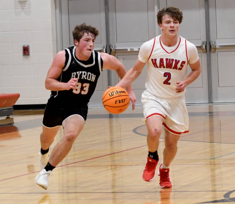 Byron's Caden Considine (33) chases's Oregon's Cooper Johnson (2) on Monday, Dec. 15, 2025 game at the 64th Forreston Holiday Tournament at Forreston High School.