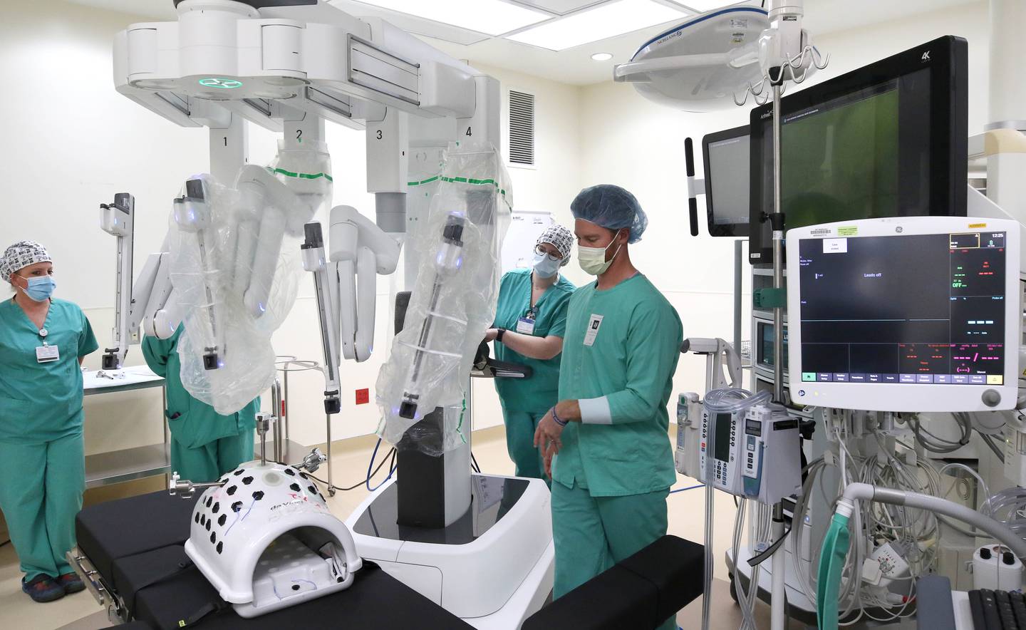 Surgical staff and a representative from the robotics company set up the newly acquired surgical robot for a training session Tuesday, Oct. 18, 2022, at Northwestern Medicine Kishwaukee Hospital in DeKalb. The robot, which can be used for a variety of surgical procedures, will be put into use for the first time at the hospital this week.