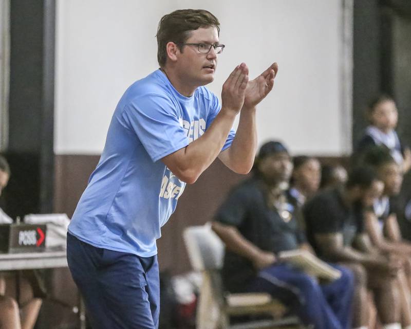 Joliet Catholic's head coach Matt Adler cheers on the team in their Morris Shootout girls basketball game.  June 18, 2025 in Morris.