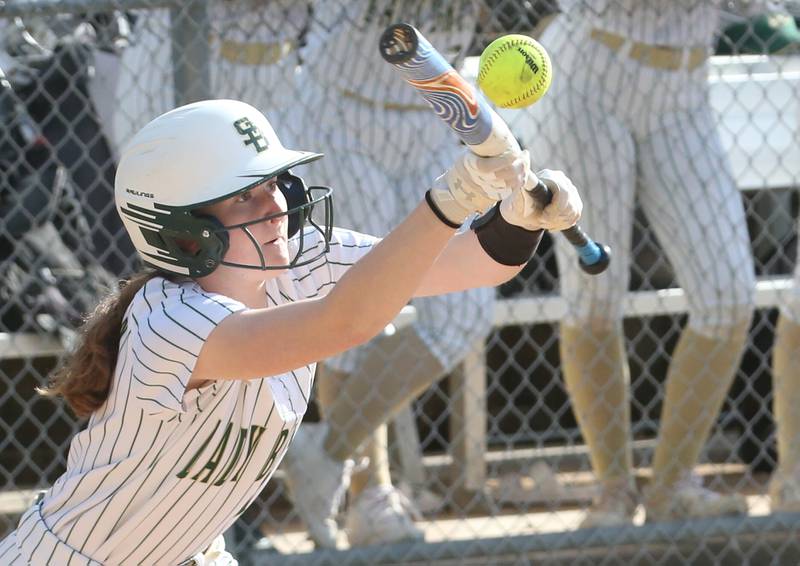 St. Bede's Lili McClain reaches up to lay down a bunt against Woodland/Flanagan-Cornell on Monday, April 29, 2024 at St. Bede Academy.