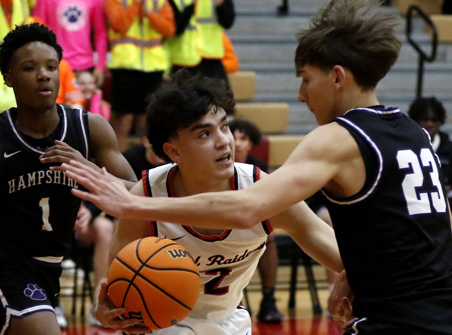 Huntley's Christian Wilson is guarded by Hampshire's Evan Wurtz as Wison drives to the basket during a Fox Valley Conference boys basketball game on Friday, Dec. 8, 2024, at Huntley High School.